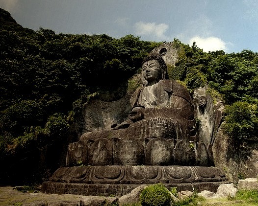 Daibutsu sculpture - a huge seated carving of Yakushi Nyorai located at the footsteps of Nokogiri-yama, Honshu, Japan.