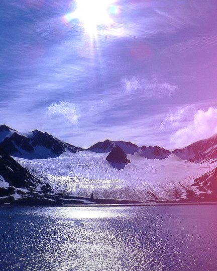The sun above Magdalenefjorden, a beautiful fjord in Svalbard Archipelago