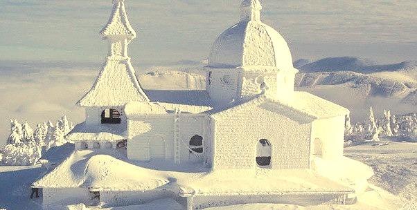 Snow covered chapel in Trojanovice, Czech Republic