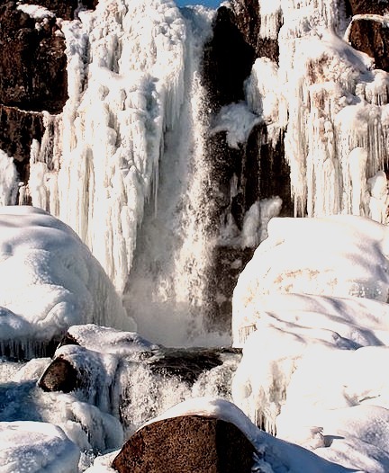 Frozen waterfall Oxarafoss in Thingvellir National Park, Iceland
